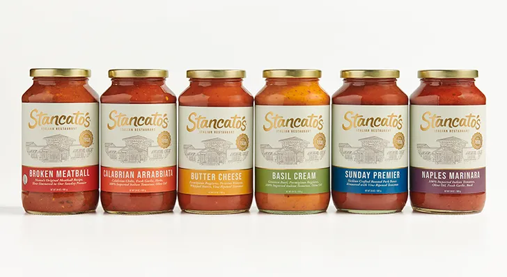 Stancato's jarred pasta sauce in a row. From left to right, Broken Meatball, Calabrian Arrabbiata, Butter Cheese, Basil Cream, Sunday Premier & Naples Marinara.